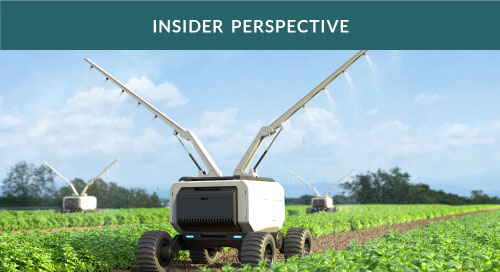 Agricultural robots spraying fertilizer in a vegetable field.